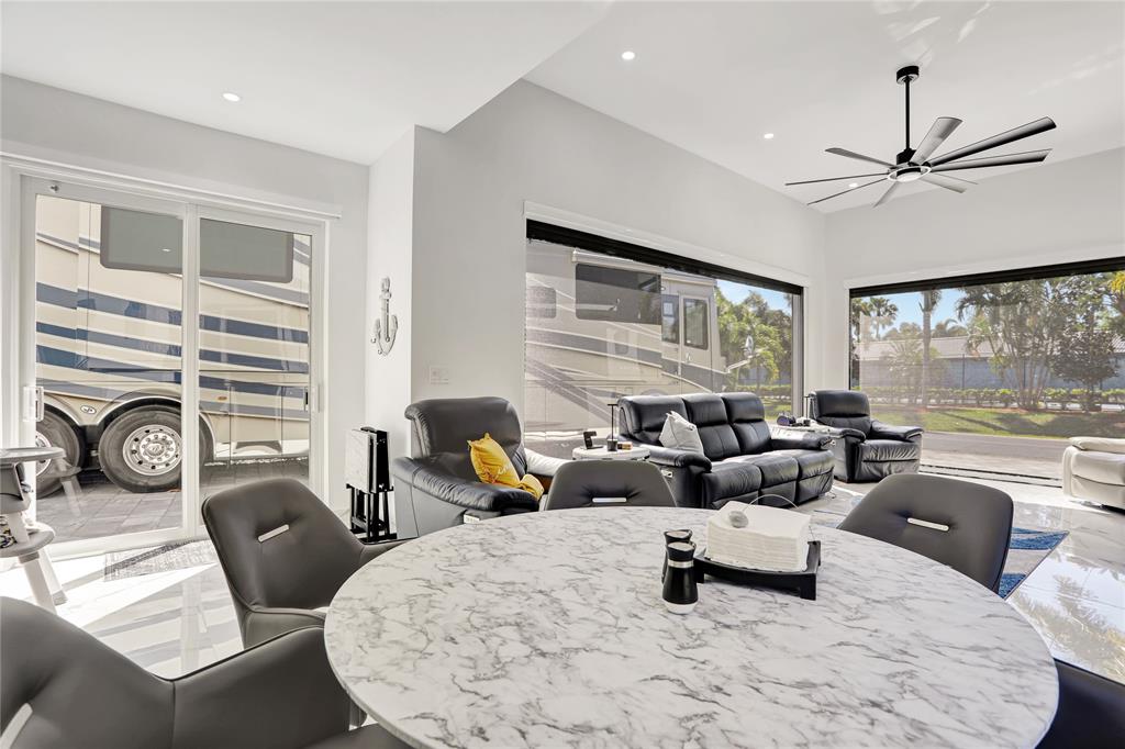 359 Sundial Circle, Unit 359 Margate, FL 33068 - Photo 14 of 36 a living room with furniture large window and flat screen tv
