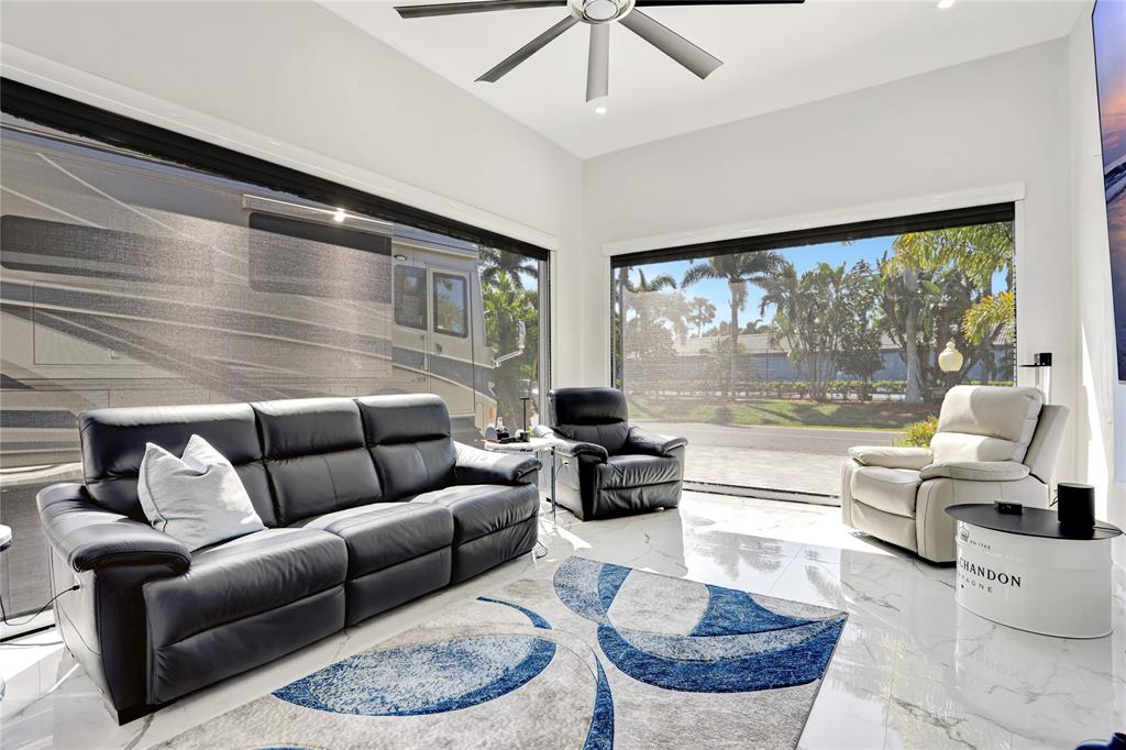 359 Sundial Circle, Unit 359 Margate, FL 33068 - Photo 15 of 36 a living room with furniture and a large window