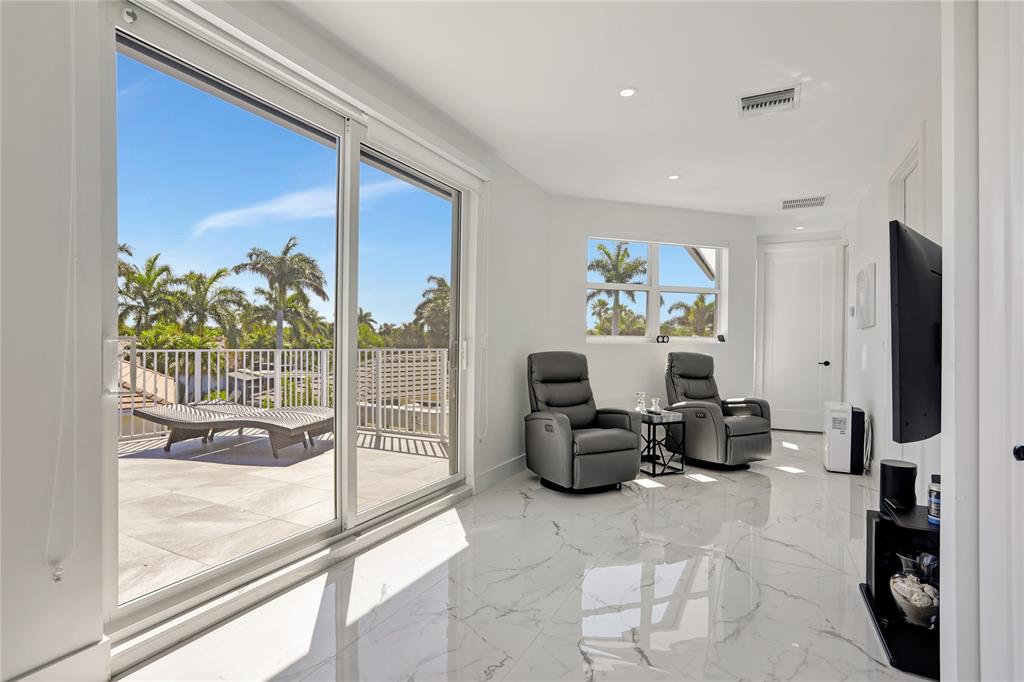 359 Sundial Circle, Unit 359 Margate, FL 33068 - Photo 17 of 36 a living room with fireplace furniture and a floor to ceiling window