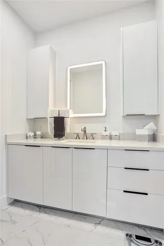 a bathroom with a sink and a mirror