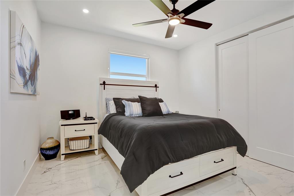 359 Sundial Circle, Unit 359 Margate, FL 33068 - Photo 23 of 36 a bedroom with a bed and a ceiling fan