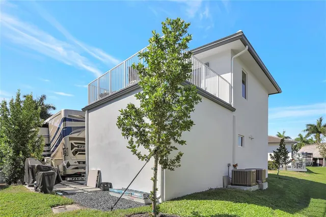 an aerial view of a house with outdoor space