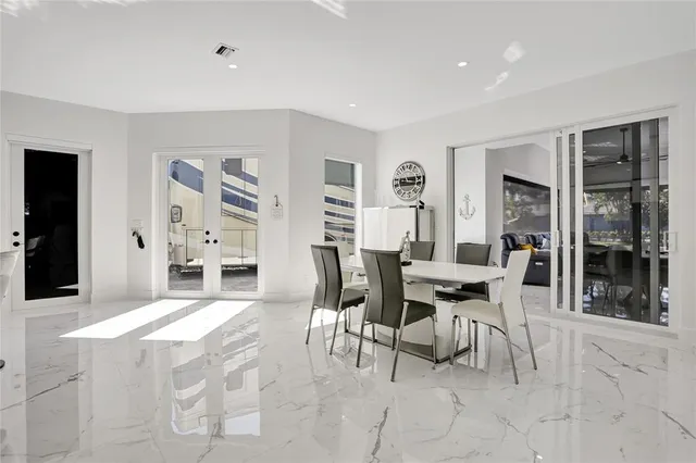 a view of a dining room with furniture and window