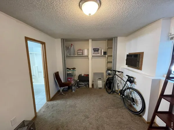a view of a livingroom with furniture and a window