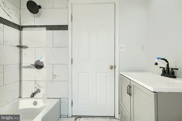a bathroom with a sink and a bathtub