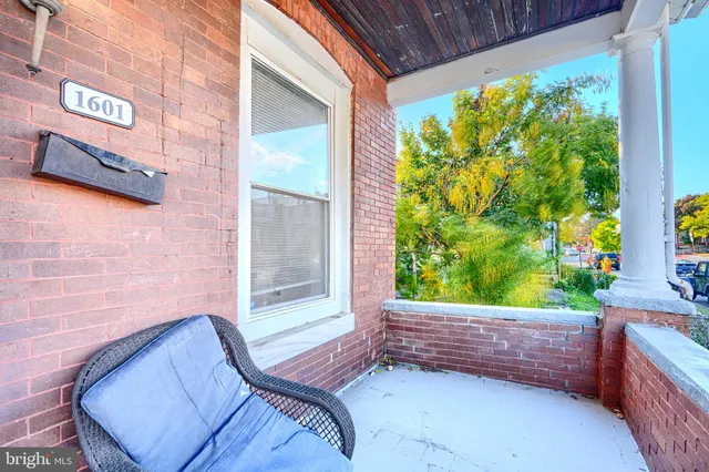 a view of a porch with a bench