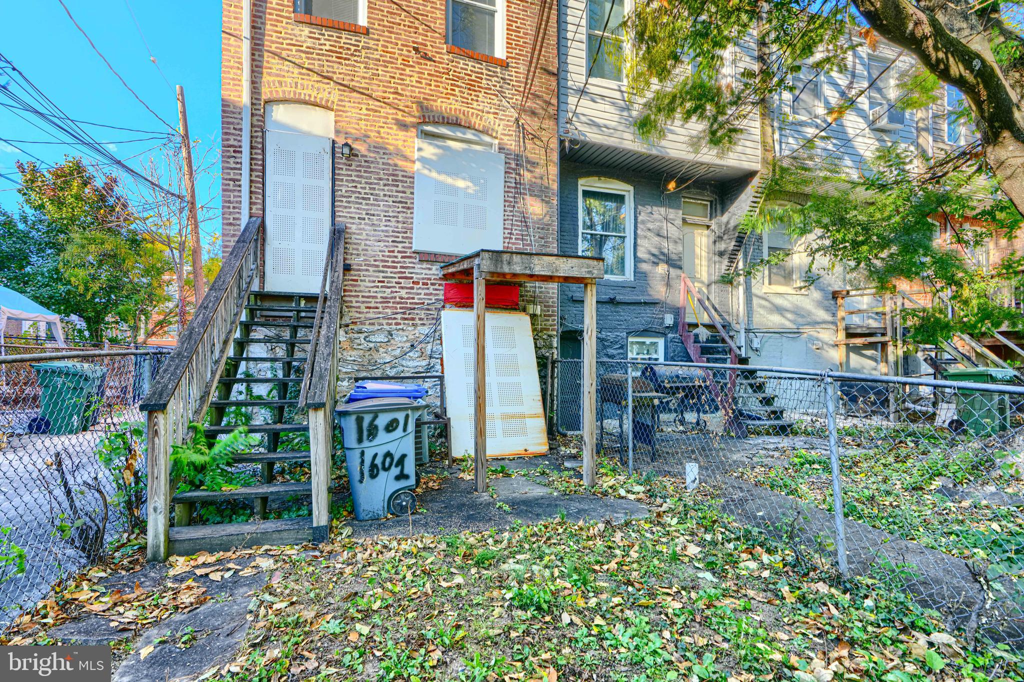 1601 East 28th Street Baltimore, MD 21218 - Photo 6 of 34 a view of a chairs and table in the backyard of the house
