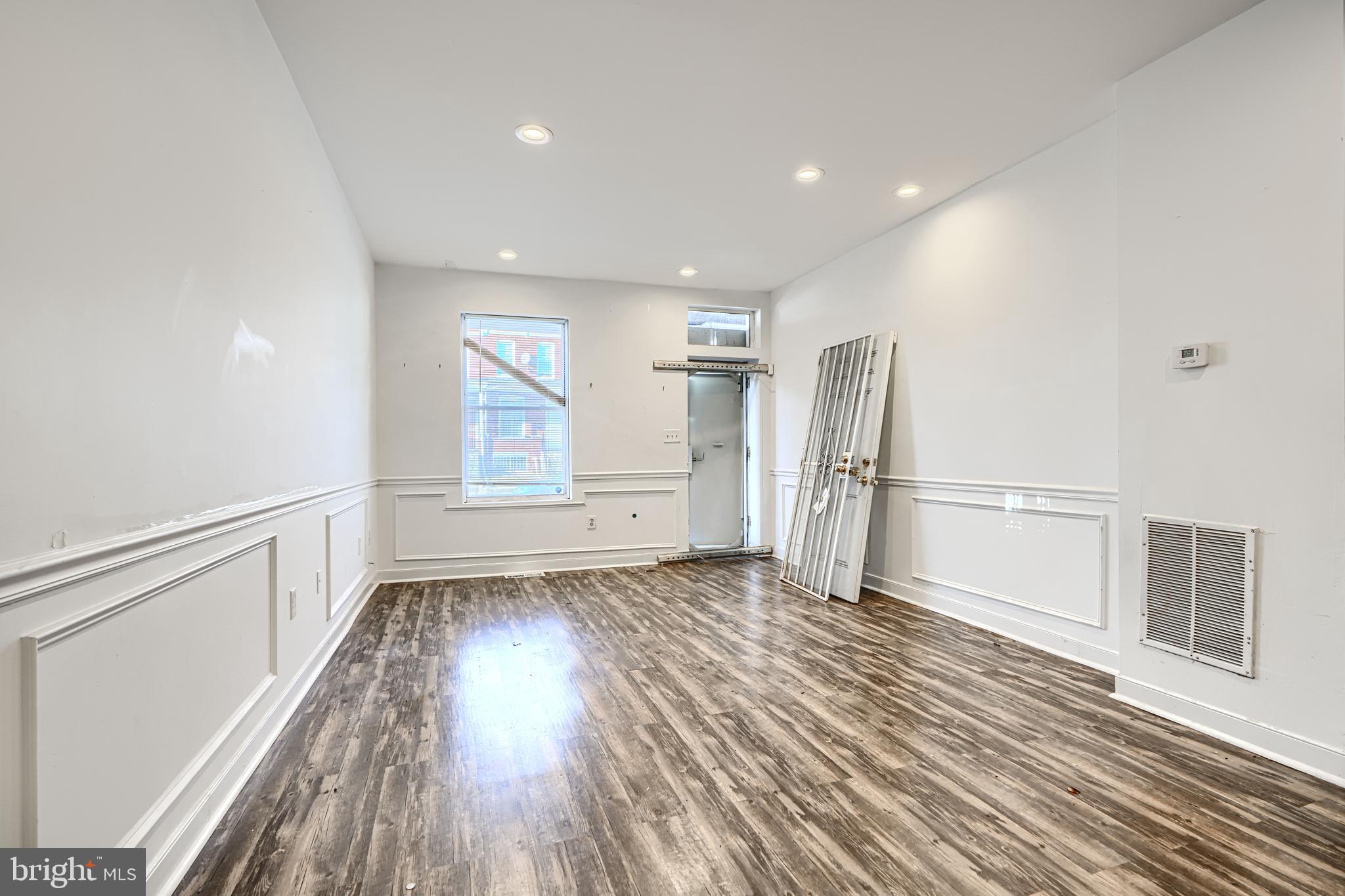 1601 East 28th Street Baltimore, MD 21218 - Photo 10 of 34 a view of a livingroom with wooden floor