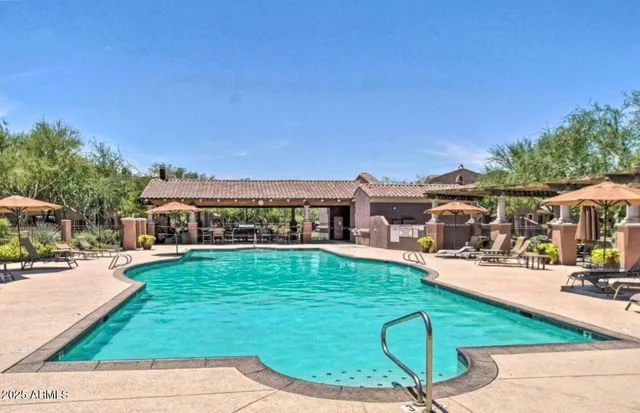 a view of a swimming pool with a patio