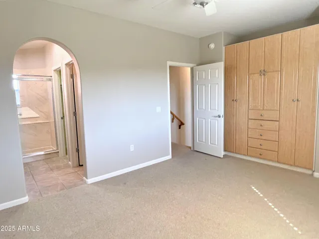 an empty room with closet area