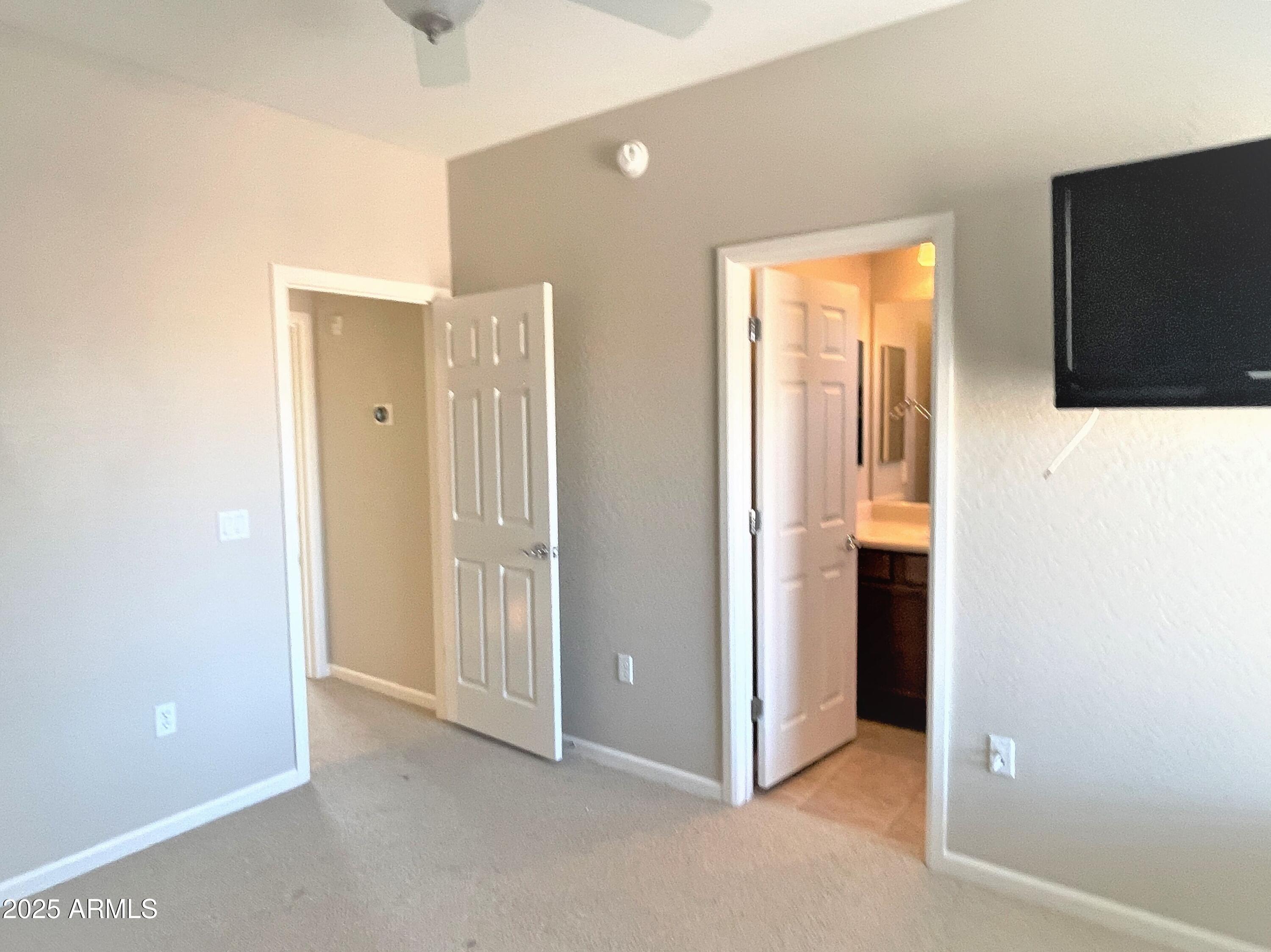 3935 East Rough Rider Road, Unit 1167 Phoenix, AZ 85050 - Photo 19 of 29 a view of an empty room with a bathroom