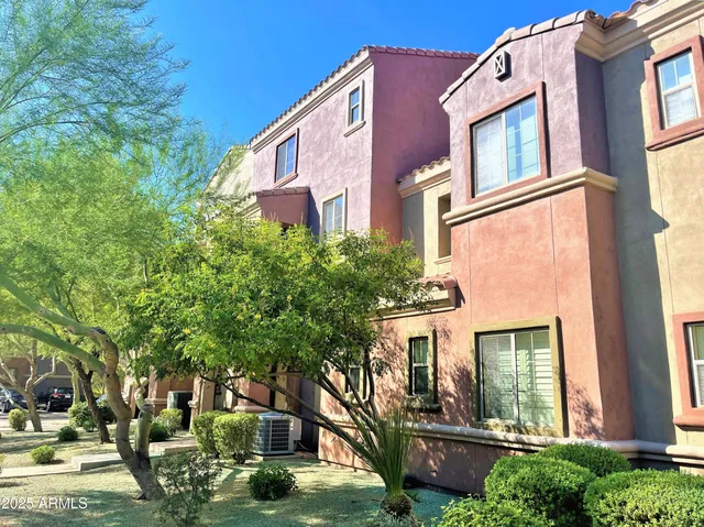 a view of a building with a yard