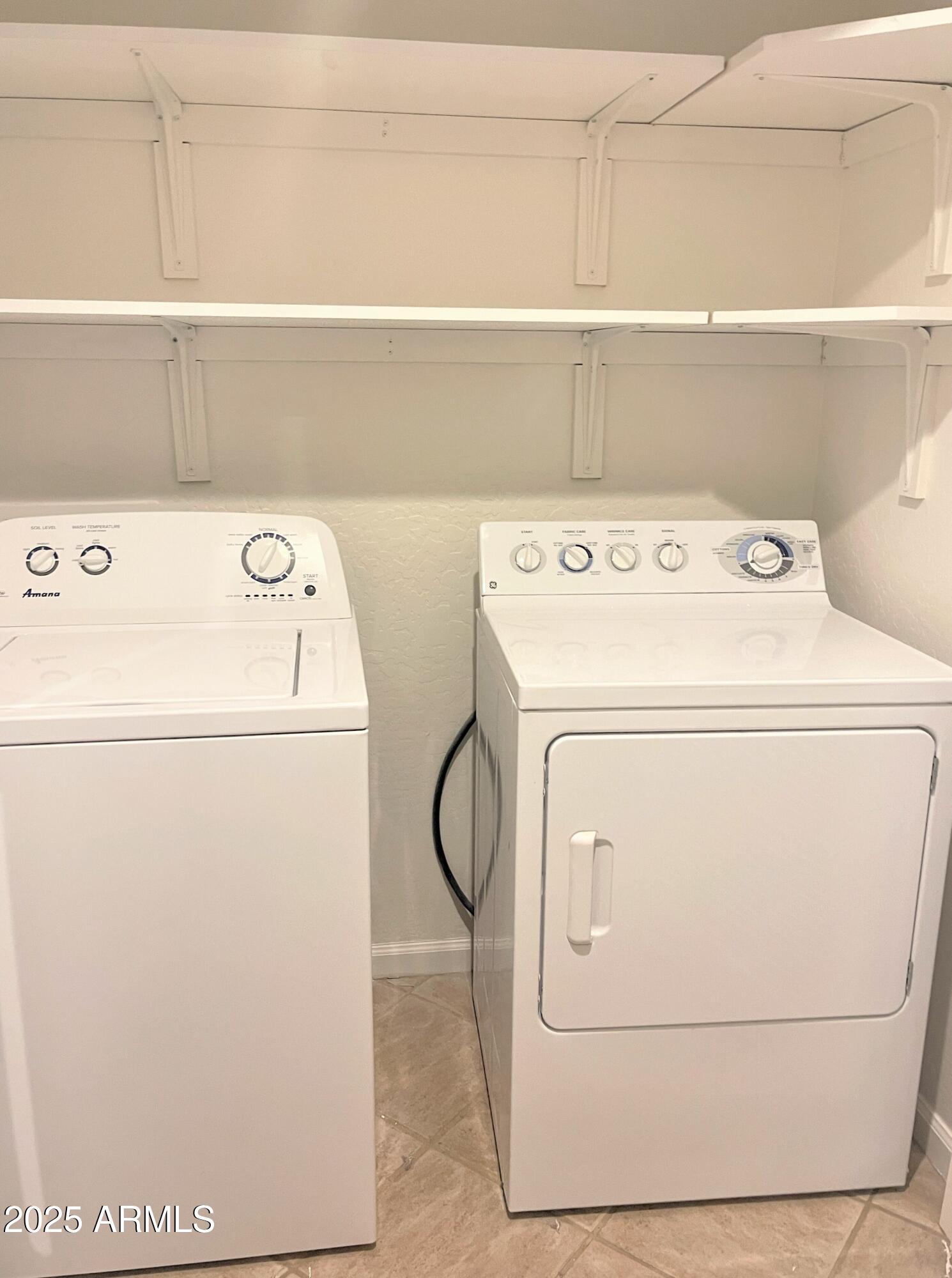 3935 East Rough Rider Road, Unit 1167 Phoenix, AZ 85050 - Photo 21 of 29 a utility room with dryer and washer