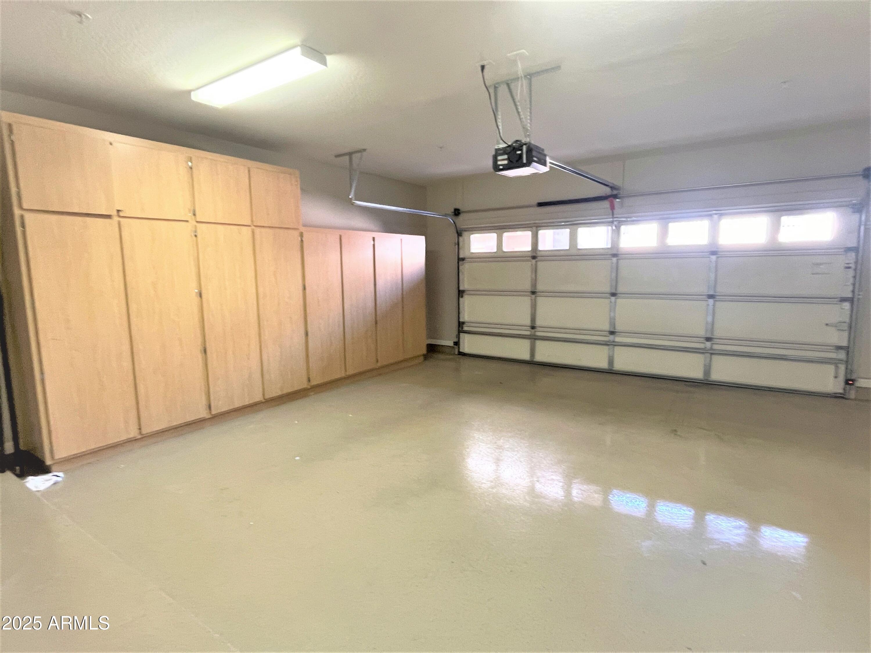 3935 East Rough Rider Road, Unit 1167 Phoenix, AZ 85050 - Photo 22 of 29 a view of a garage