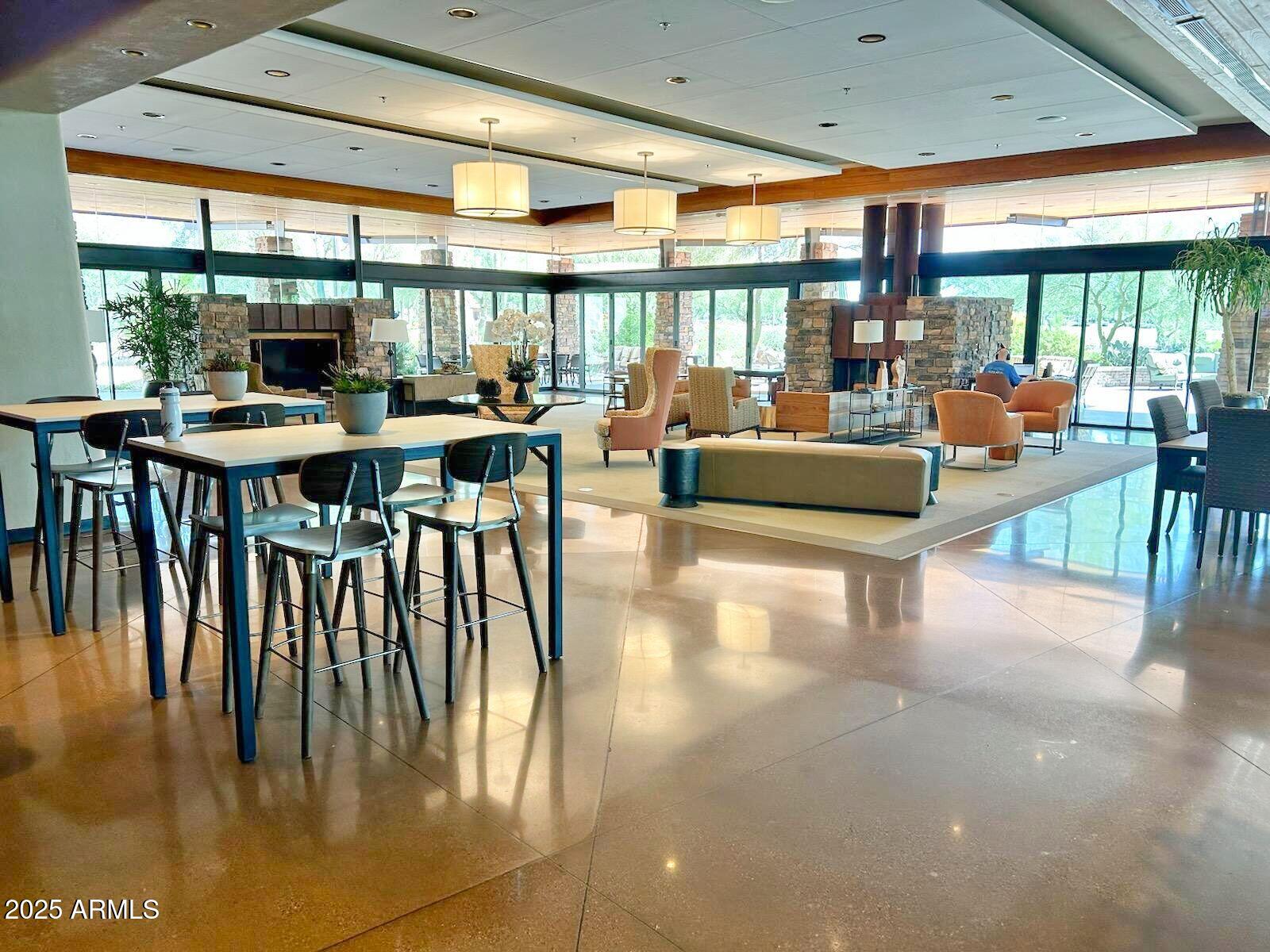 3935 East Rough Rider Road, Unit 1167 Phoenix, AZ 85050 - Photo 25 of 29 a living room with furniture and a large window