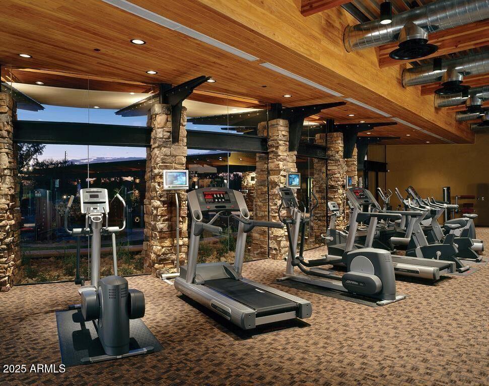 3935 East Rough Rider Road, Unit 1167 Phoenix, AZ 85050 - Photo 26 of 29 a view of a room with gym equipment