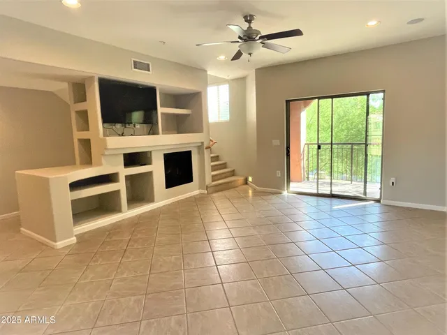 a view of a livingroom with a flat screen tv