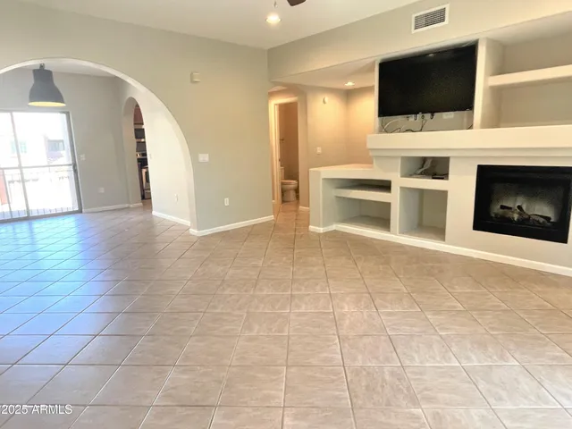 a view of living room with furniture and flat screen tv