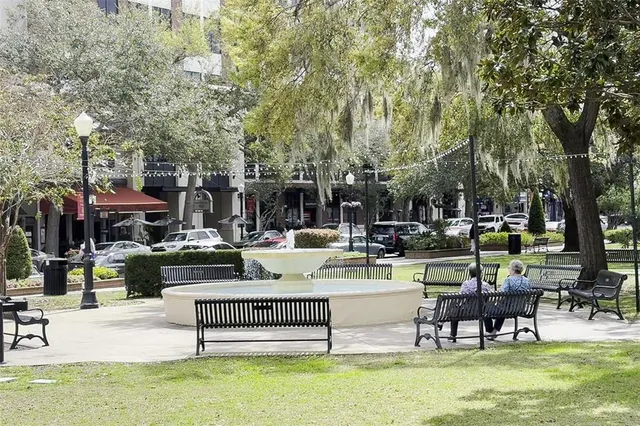 a view of a park with furniture
