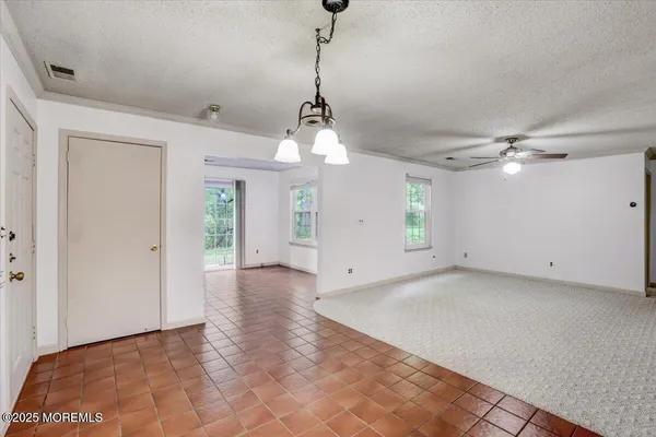 a view of a big room with windows and cabinet