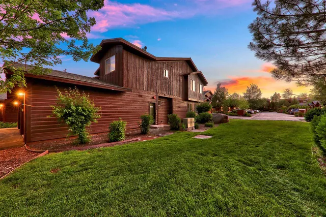 a view of a house with a yard