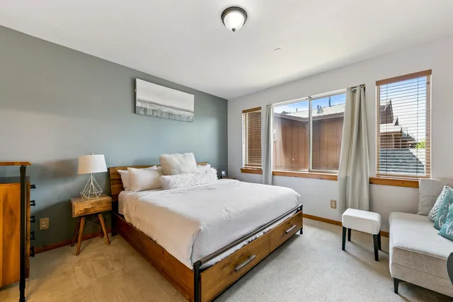 a bedroom with a bed and a couch