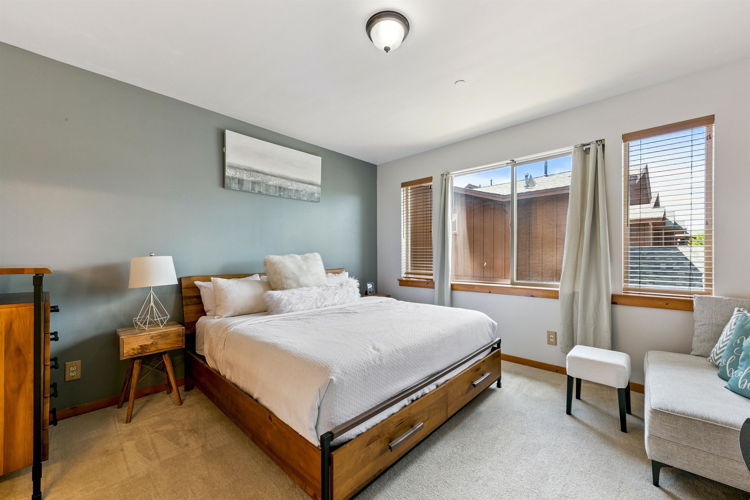 10592 Boulders Road, Unit 8 Truckee, CA 96161 - Photo 13 of 27 a bedroom with a bed and a couch