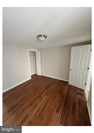 a view of wooden floor in an empty room
