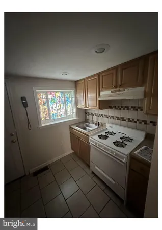 a kitchen with a stove and a microwave