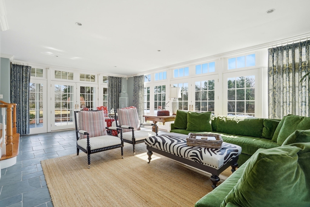 65 Partridge Road Duxbury, MA 02332 - Photo 12 of 42 a living room with furniture and a floor to ceiling window