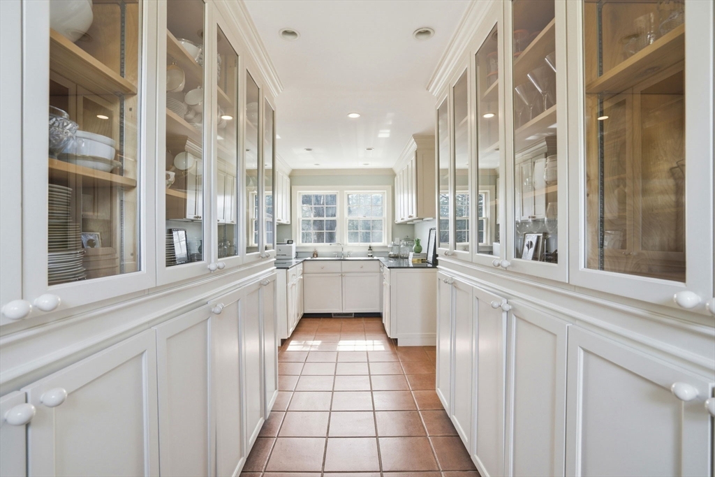 65 Partridge Road Duxbury, MA 02332 - Photo 17 of 42 a large white kitchen with a large window