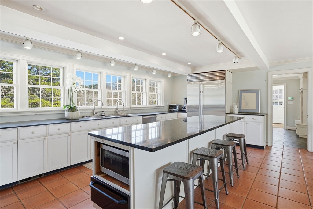 65 Partridge Road Duxbury, MA 02332 - Photo 19 of 42 a large kitchen with granite countertop a large counter top space and stainless steel appliances