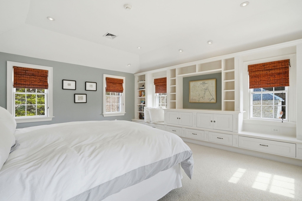 65 Partridge Road Duxbury, MA 02332 - Photo 27 of 42 a spacious bedroom with a large bed and windows