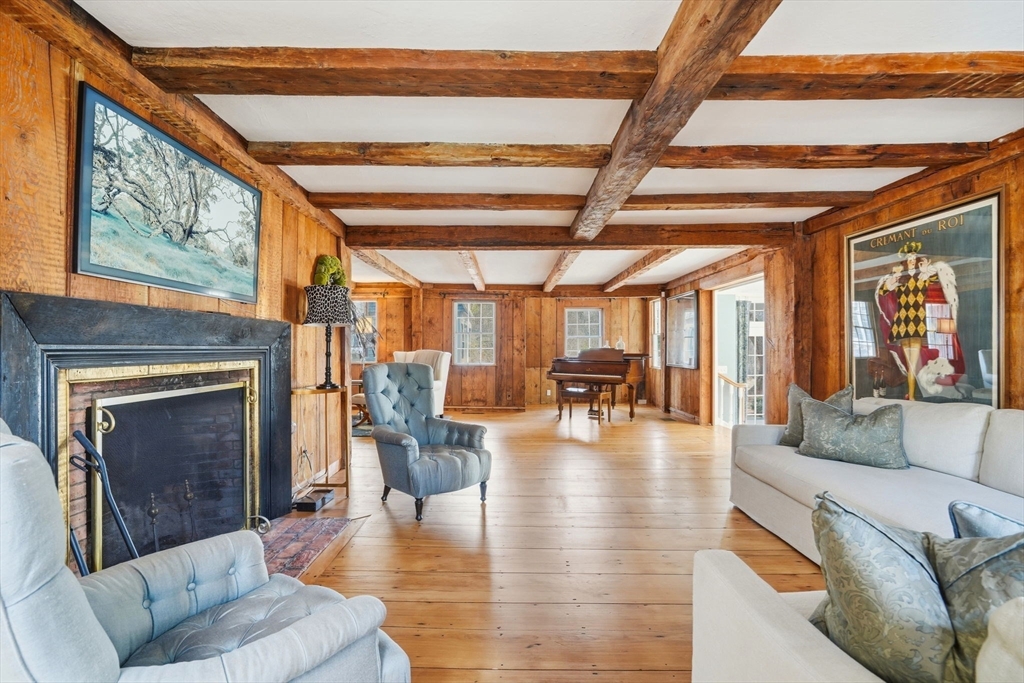 65 Partridge Road Duxbury, MA 02332 - Photo 10 of 42 a living room with furniture and a fireplace
