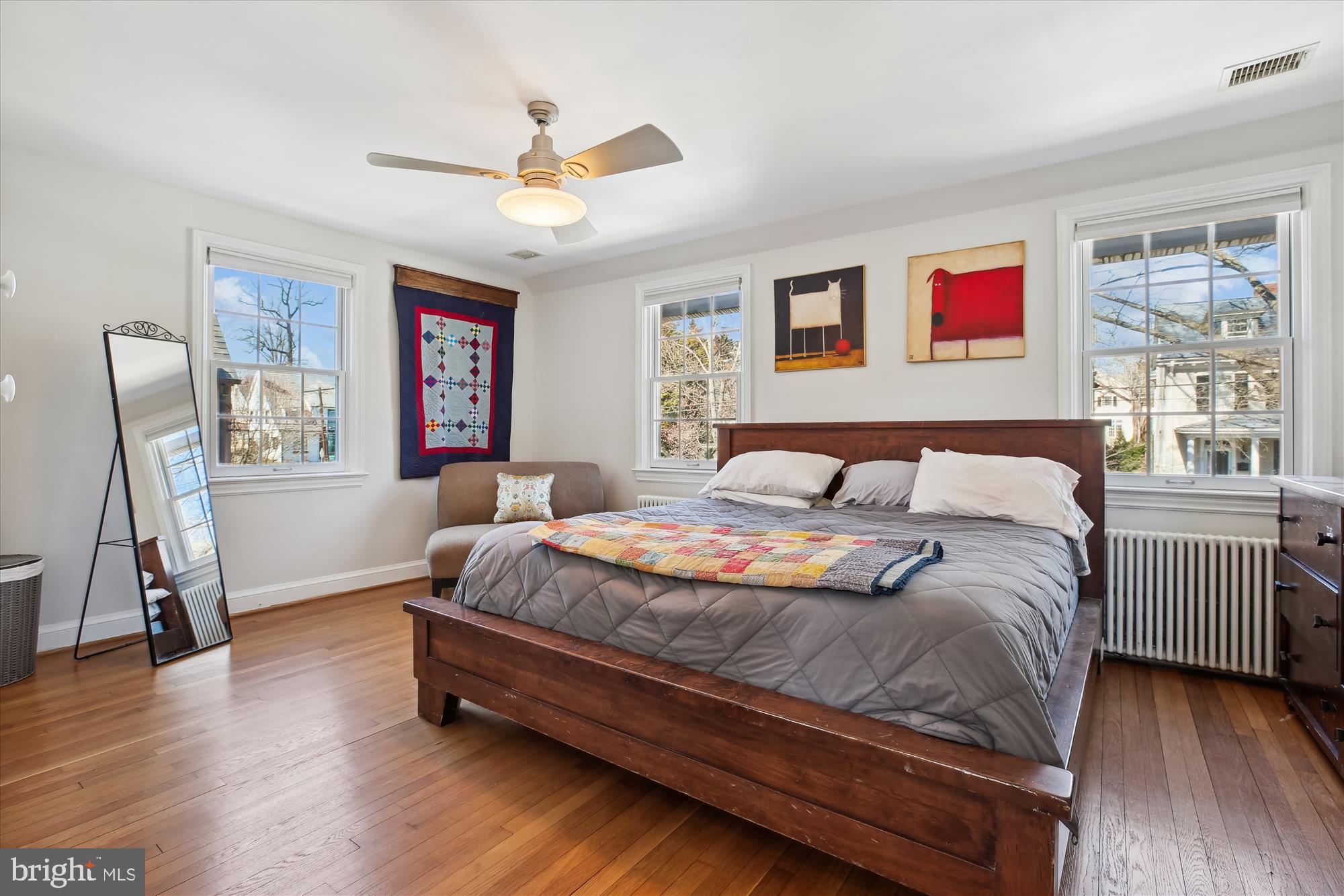 3530 Quesada Street Northwest Washington, DC 20015 - Photo 19 of 54 a bedroom with a bed and wooden floor