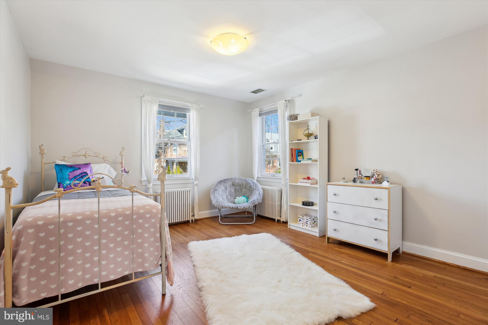 3530 Quesada Street Northwest Washington, DC 20015 - Photo 25 of 54 a bedroom with a bed and wooden floor