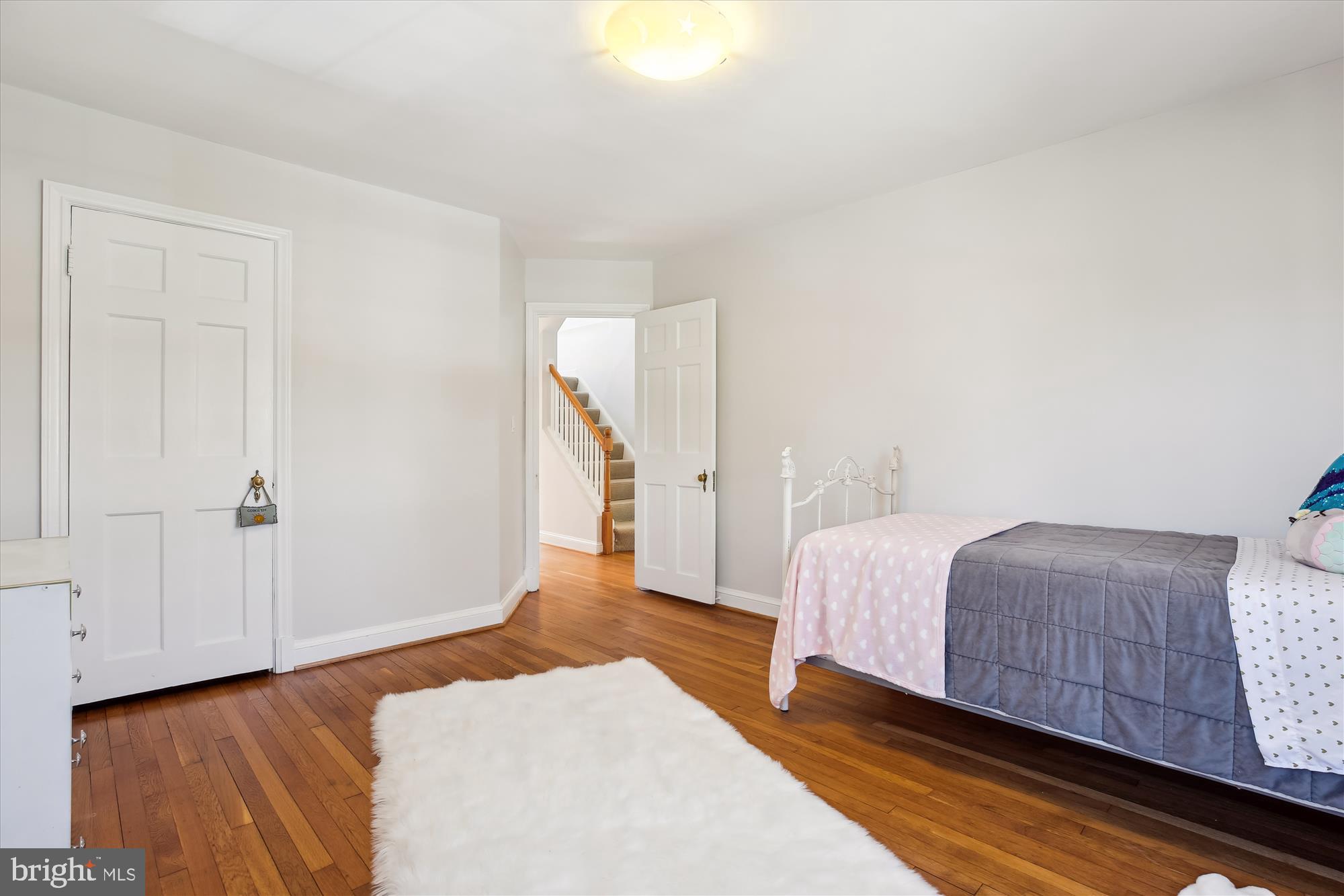 3530 Quesada Street Northwest Washington, DC 20015 - Photo 26 of 54 a bedroom with a bed and a night stand
