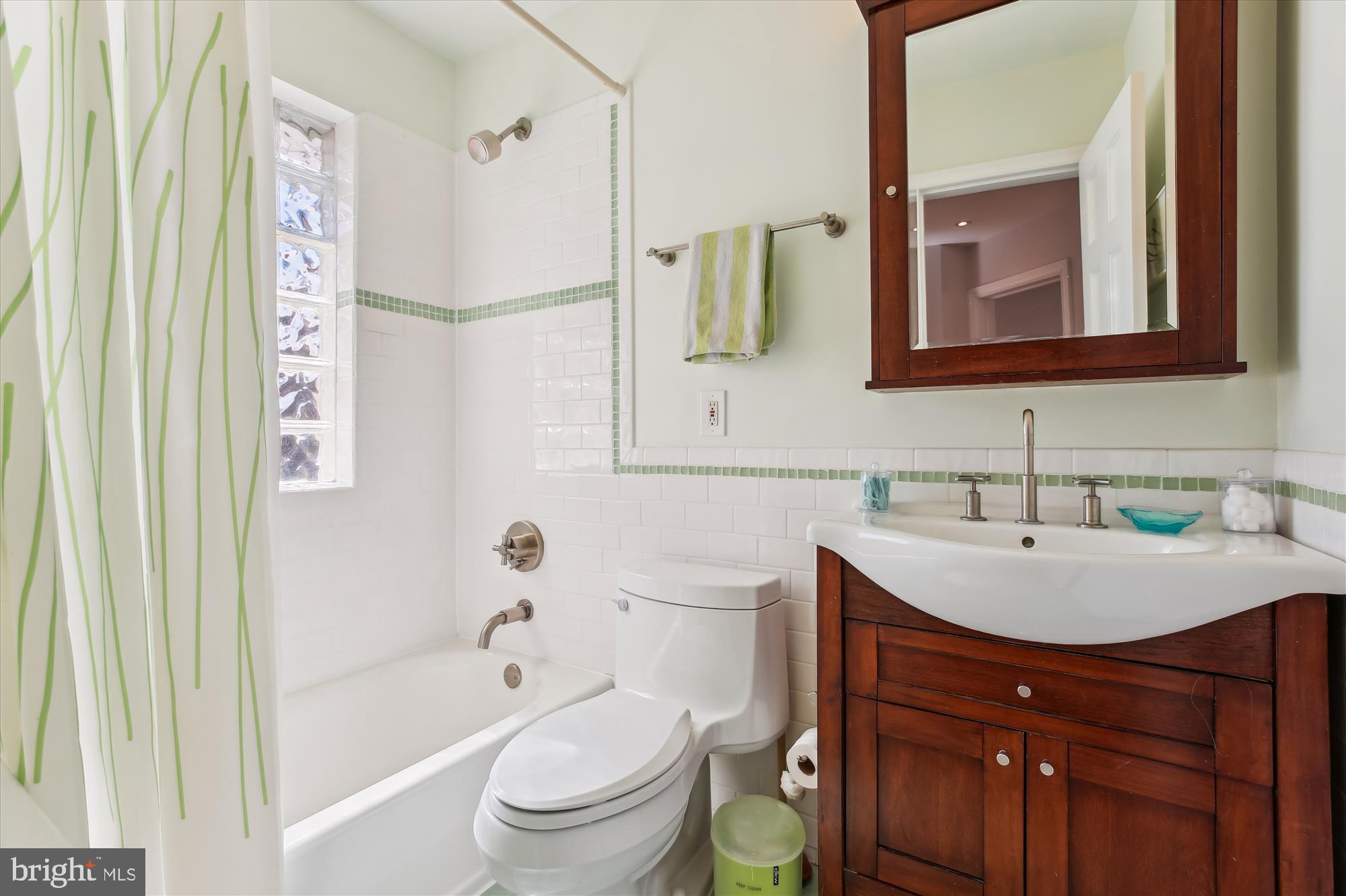 3530 Quesada Street Northwest Washington, DC 20015 - Photo 27 of 54 a bathroom with a sink toilet vanity and shower