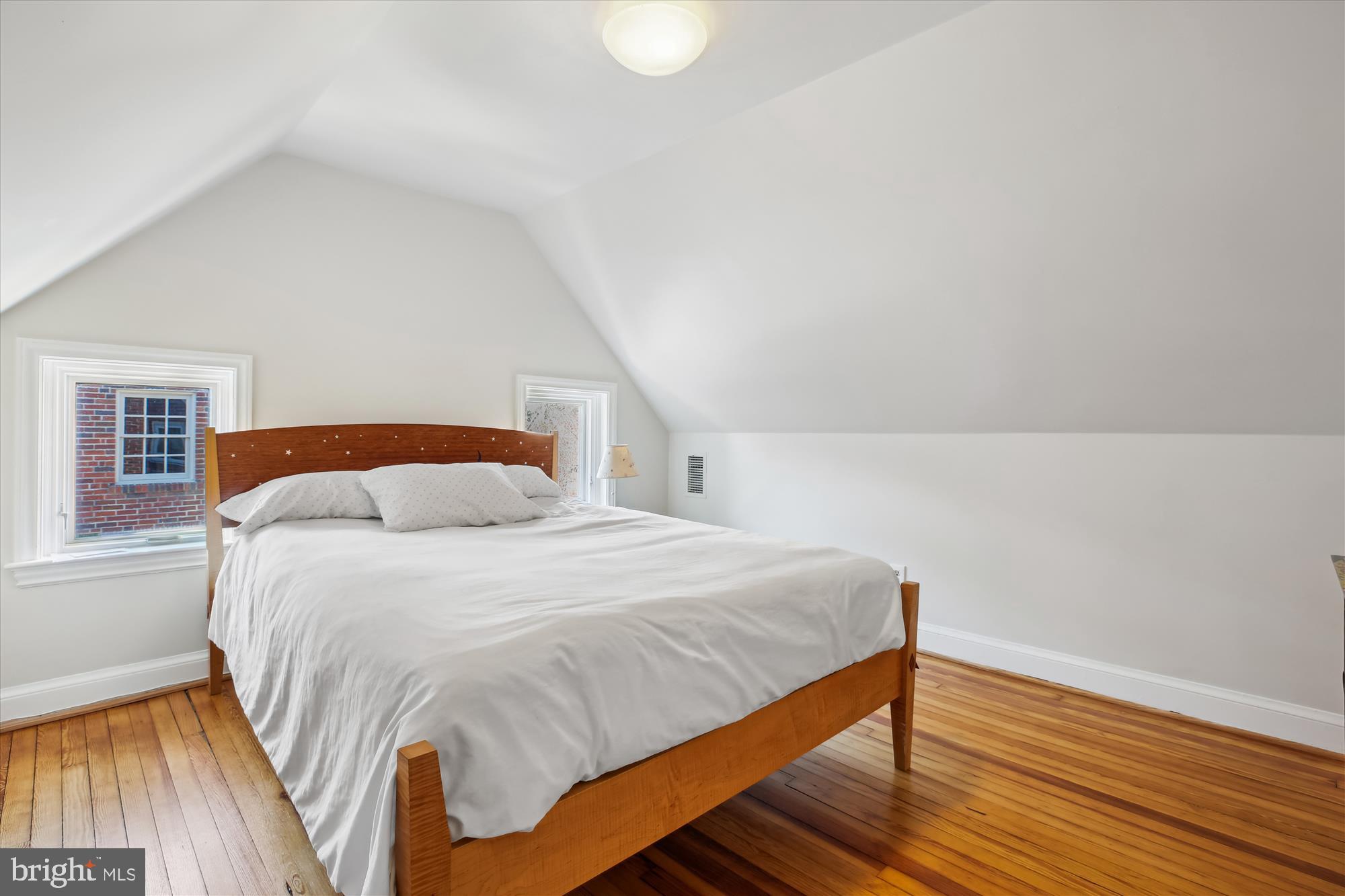 3530 Quesada Street Northwest Washington, DC 20015 - Photo 32 of 54 a bedroom with a bed and wooden floor