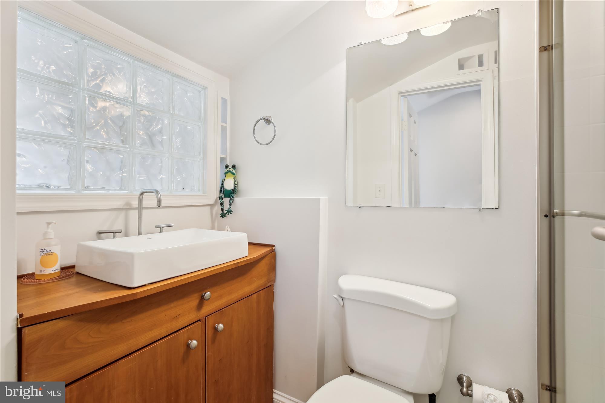 3530 Quesada Street Northwest Washington, DC 20015 - Photo 34 of 54 a bathroom with a sink a toilet and mirror