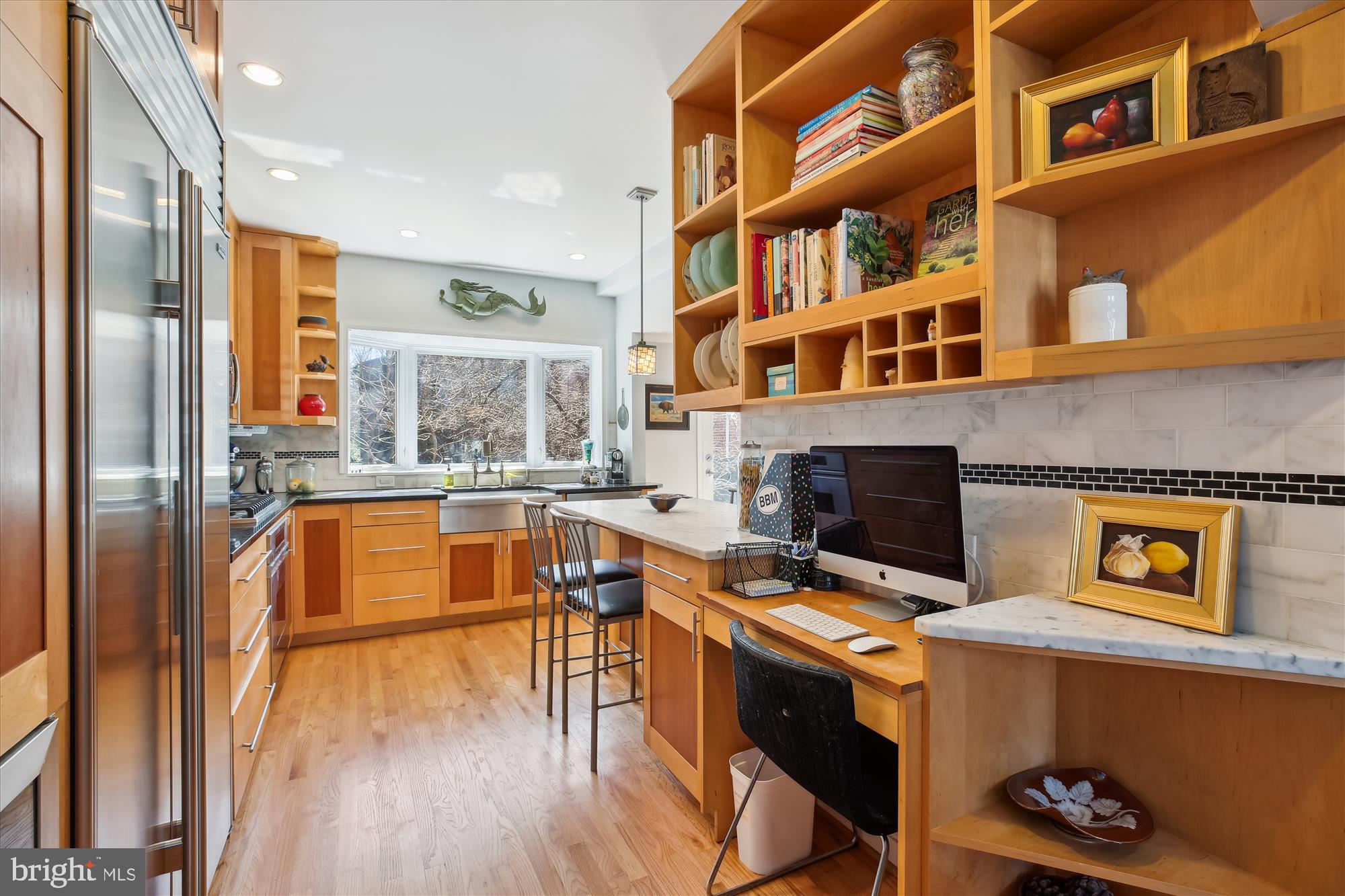 3530 Quesada Street Northwest Washington, DC 20015 - Photo 7 of 54 a kitchen with stainless steel appliances granite countertop a stove and a refrigerator