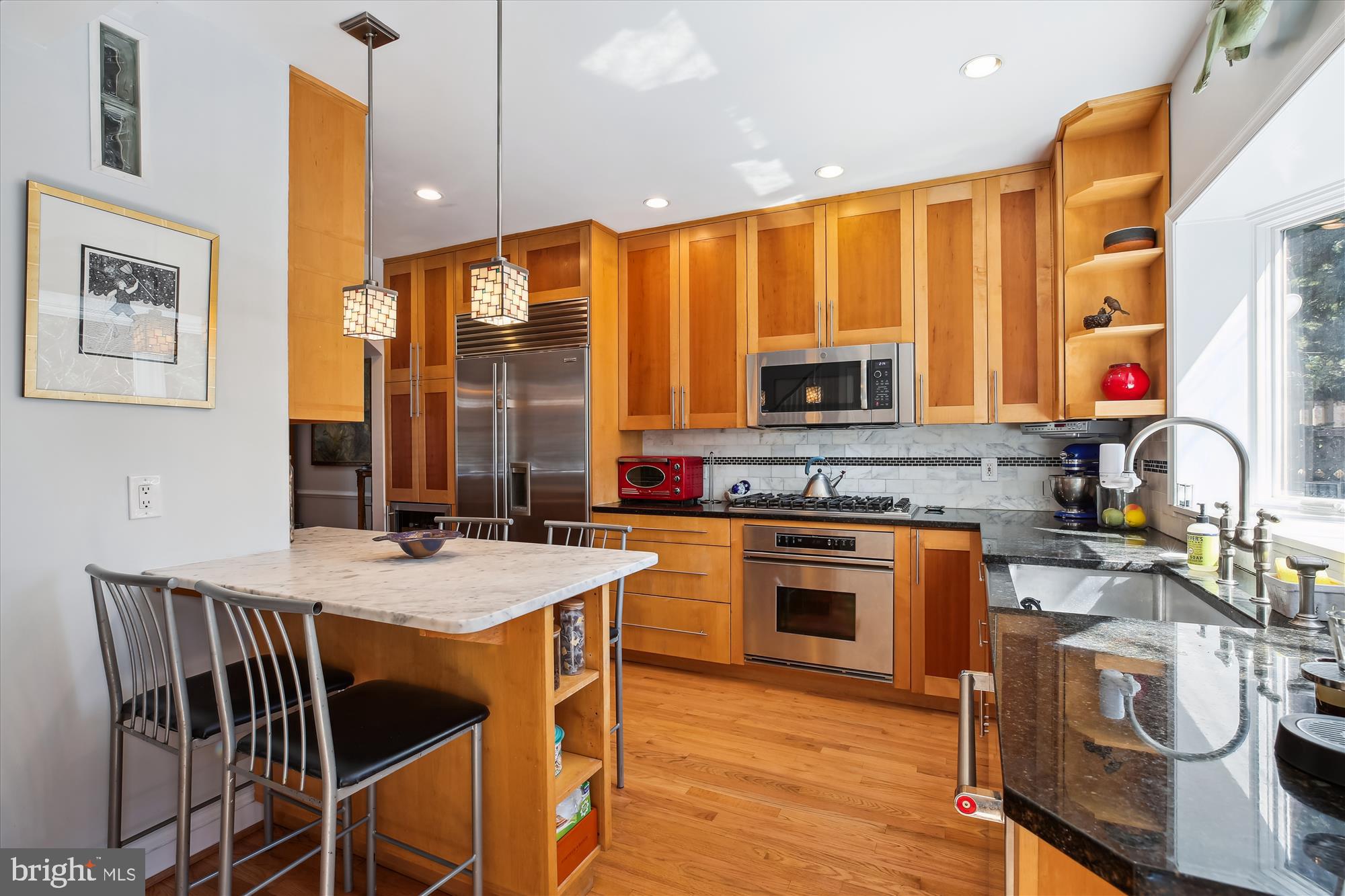 3530 Quesada Street Northwest Washington, DC 20015 - Photo 9 of 54 a kitchen with a stove a sink and a refrigerator
