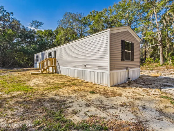 a view of backyard of house