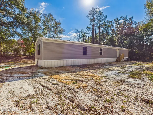 a view of a backyard of the house
