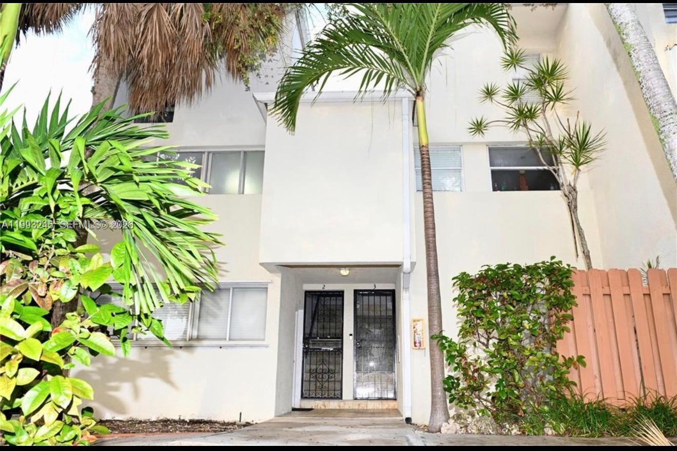 1910 Southwest 17th Avenue, Unit 4 Miami, FL 33145 - Photo 1 of 19 a front view of a house with a yard