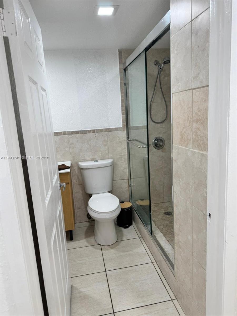 1910 Southwest 17th Avenue, Unit 4 Miami, FL 33145 - Photo 15 of 19 a bathroom with a toilet and a shower