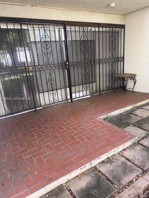 1910 Southwest 17th Avenue, Unit 4 Miami, FL 33145 - Photo 17 of 19 a view of a black gate