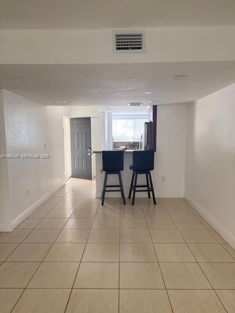 1910 Southwest 17th Avenue, Unit 4 Miami, FL 33145 - Photo 9 of 19 a view of a kitchen with furniture and window