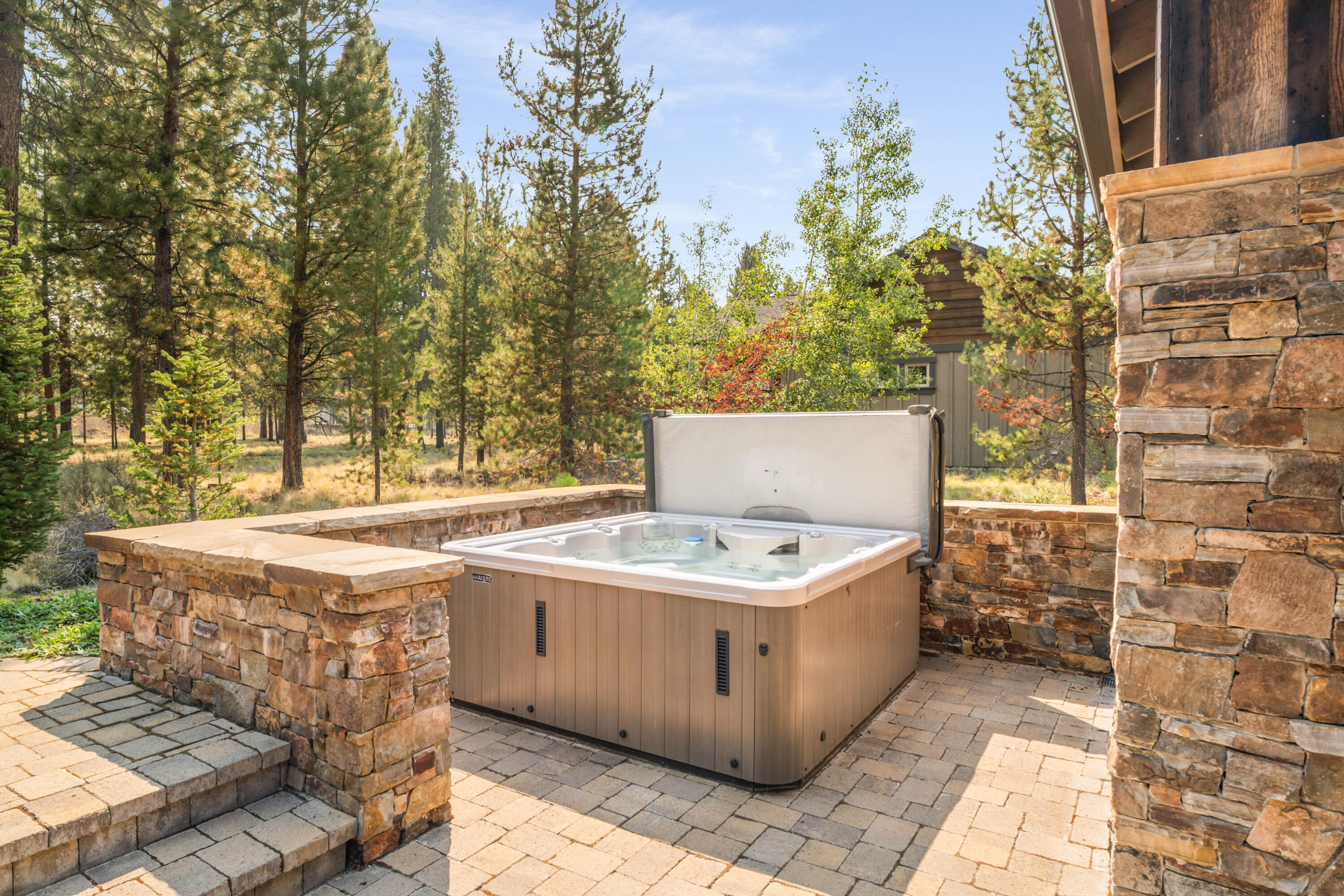 56641 Sunstone Loop, Unit 135 Bend, OR 97707 - Photo 51 of 62 Radiant ice-melt has been added from the slider to the hot tub & along the pathway to the garbage area.