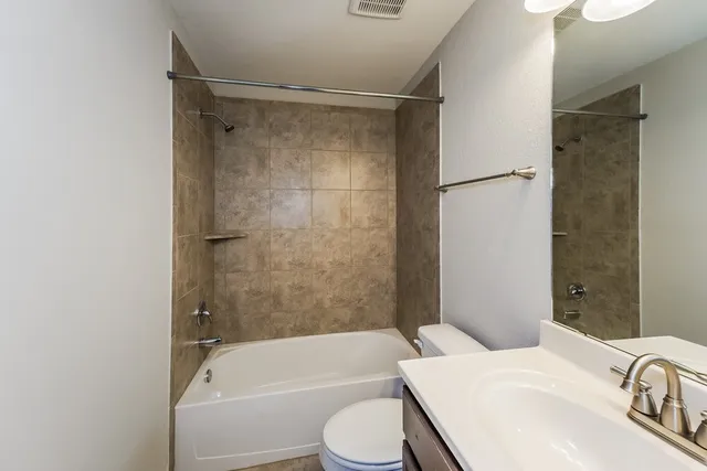 a bathroom with a sink toilet and a bathtub
